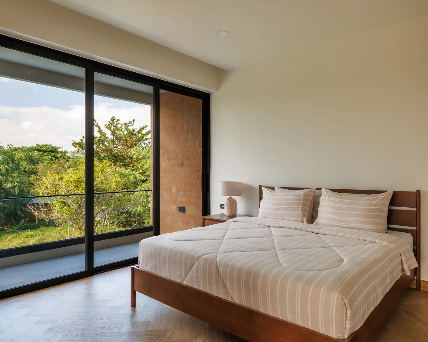 Master bedroom with a calm green outlook